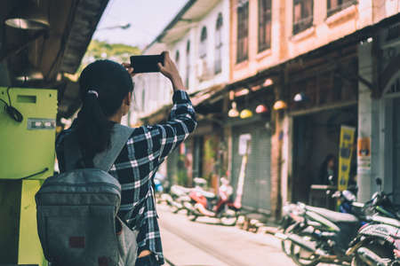 Woman travel around the world with backpack freedom and relax life concept.の写真素材