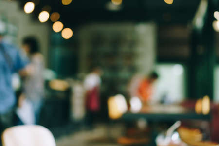 Blur coffee and restutant cafe with customers background vintage tone color style.の写真素材