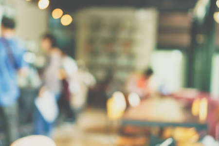 Blur coffee and restutant cafe with customers background vintage tone color style.の写真素材
