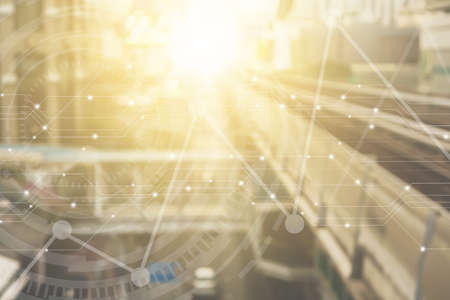 Blur capital town many buildings in city with transportation system double exposure graph and technology icon  with sunlight background.の写真素材