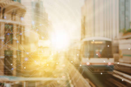 Blur capital town many buildings in city with transportation system double exposure graph and technology icon  with sunlight background.の写真素材