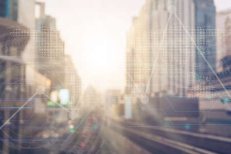 Blur capital town many buildings in city with transportation system double exposure graph and technology icon  with sunlight background.の写真素材