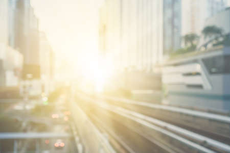 Blur capital town many buildings in city with transportation system double exposure graph and technology icon  with sunlight background.の写真素材