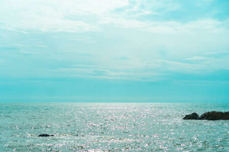 Beach with island sun light and blue sky background.の写真素材