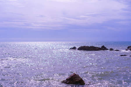 Beach with island sun light and blue sky background.の写真素材