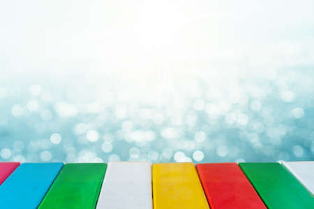 Selective focus of old wood table with blur beautiful beach background for display your product.の写真素材