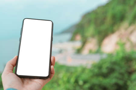 Woman hand using smartphone with copy space white color on screen background. Business, financial, trade stock maket and social network concept.の写真素材