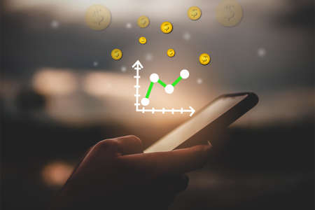 Market stock graph icon screen of smartphone background. Financial business technology freedom dream life using internet freedom life concept.の写真素材