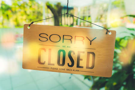 Sorry we are closed sign hang on door at coffee shop.の写真素材