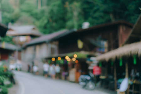 Blur street small village in mountain evening time  with people relax and chill out on vacation day in nature background.の写真素材