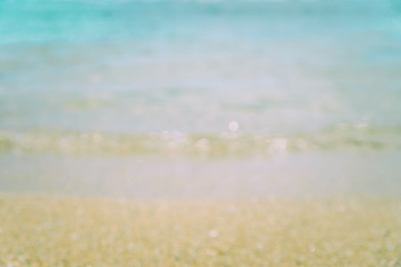 Blur Beach in summer with sun light and bokeh abstract  background.