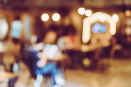 Blur coffee and restutant cafe with customers background vintage tone color style.の写真素材