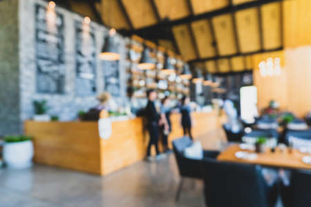 Blur coffee and restutant cafe with customers background vintage tone color style.の写真素材