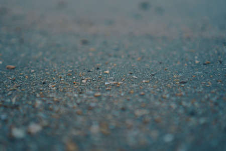 Copy space of grey sand and blue color summer beach background texture.の写真素材