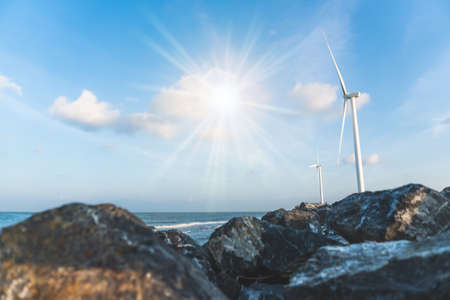 Wind energy converter as wind turbine ecology system clean power with blue sky background.の写真素材