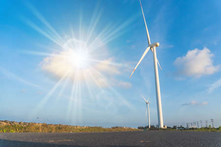 Wind energy converter as wind turbine ecology system clean power with blue sky background.の写真素材