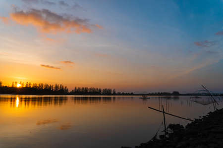 View of waterproof dam with sunset sky beautiful background.の写真素材