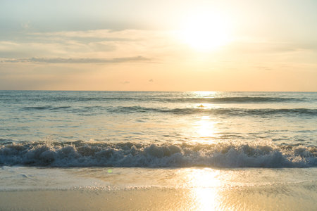 Tropical nature clean beach and white sand in summer with sun light blue sky and bokeh abstract ...