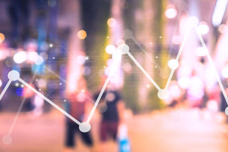 Blur capital town many buildings and people in city with transportation system double exposure graph uptrend or downtrend and technology icon  with sunlight background.の写真素材