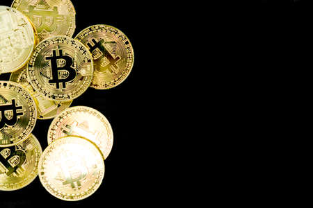 Stack of bitcoins symbol of digital money as cryptocurrency with black background with copyspace that you can put text on.の写真素材