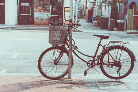 Blur Sino-Portuguese Architecture building in town with vintage style color tone with traveller travel vibe shopping at walking street background.の写真素材