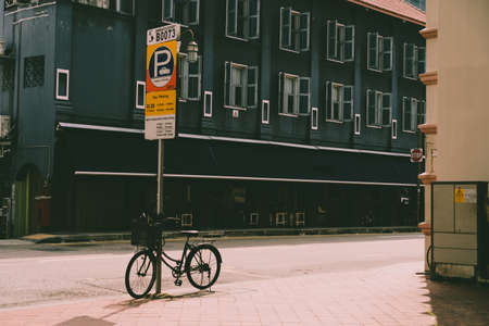 Blur Sino-Portuguese Architecture building in town with vintage style color tone with traveller travel vibe shopping at walking street background.のeditorial素材