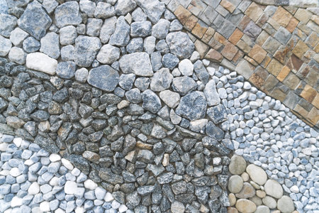 Mixed type of stone with many color on wall background texture.