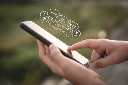 Women hand using smartphone typing, chatting conversation or comment. Social media maketing business communication technology  concept.の写真素材