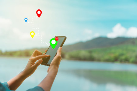 People use smartphone to check map to travel with internet and gps application for vacation or...
