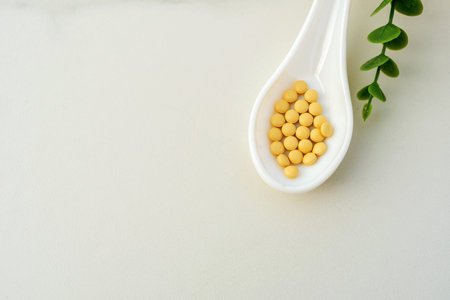 Mixed of pill or tablet medicine on white spoon on white background. Health care medicine cure disease lifestyle trend concept.の写真素材