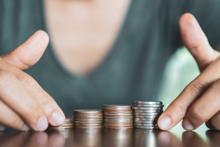 Business financial success concept. Gold coins on table and green nature bokeh background.Bullish...