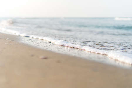 Tropical nature clean beach and white sand in summer with sun light blue sky and bokeh abstract  background.の写真素材