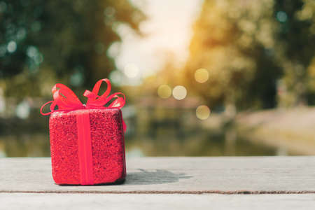 Gift or present boxes on green bokeh nature background.の写真素材