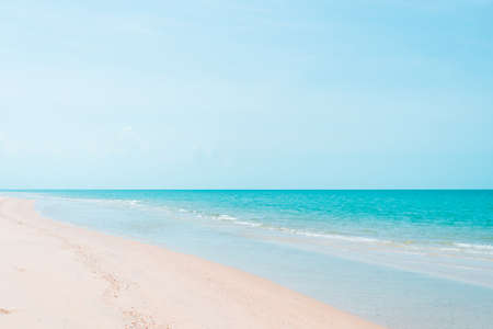 Tropical nature clean beach and white sand in summer with sun light blue sky and bokeh abstract  background.の写真素材