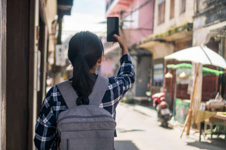 Woman travel around the world with backpack freedom and relax life concept.の写真素材