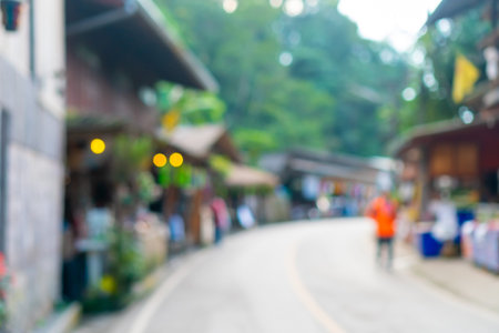Blur small conservative village in valley mountain background.