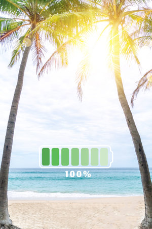 Fully charge battery 100% sign icon on natare summer beach on vacation day. Holiday long weekend...