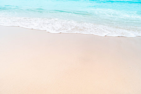 Tropical nature clean beach and white sand in summer with sun light blue sky and bokeh abstract ...