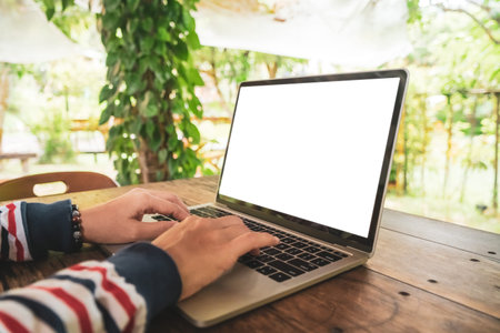 Woman using laptop and smartphone to work study in vacation day at resort room background.