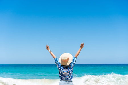 Woman travel around the world with summer beach freedom and relax life concept.