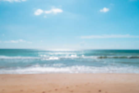 Blur summer bokeh beach with sun light and blue sky background.の写真素材