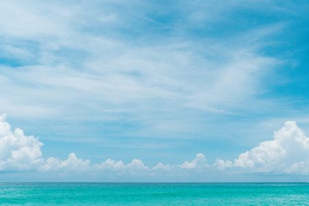 Tropical nature clean beach and white sand in summer with sun light blue sky and bokeh abstract ...