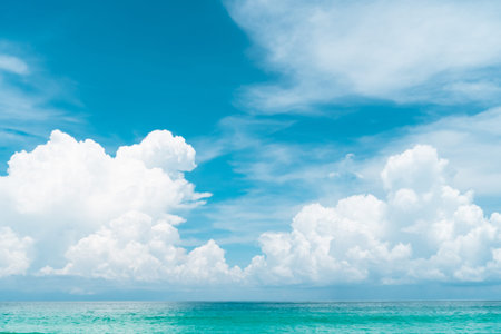 Tropical nature clean beach and white sand in summer with sun light blue sky and bokeh abstract ...