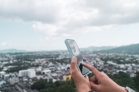 Woman hand using smartphone to do work business, social network, communication with city view...