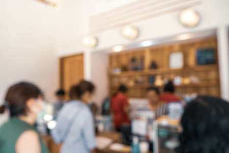 Blur coffee and restutant cafe with customers background vintage tone color style.の写真素材