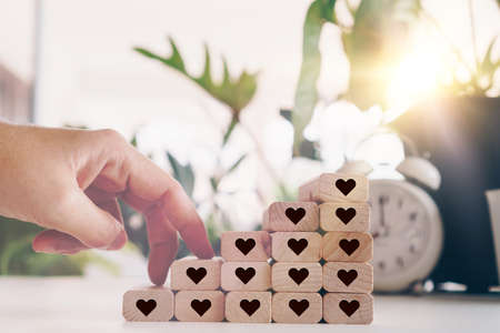 Heart icon on wooden step board with blank copy space background. Valentine love holiday concept.の写真素材