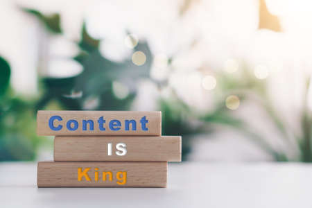 Content is king on wooden board with copy space background. Online business concept.の写真素材