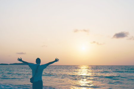Man rise hands up to sky travel around the world with summer beach freedom and relax life.