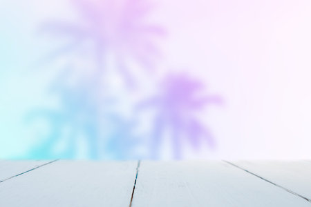 Selective focus of old wood table with blur beautiful beach with tropical palm tree for display your...