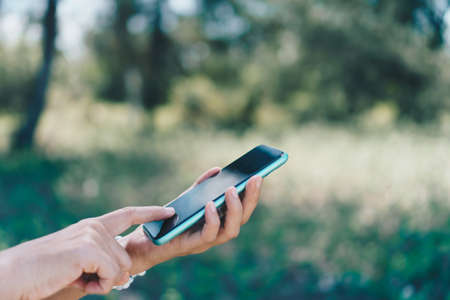 Woman hand using smartphone to do work business, social network, communication concept.の写真素材